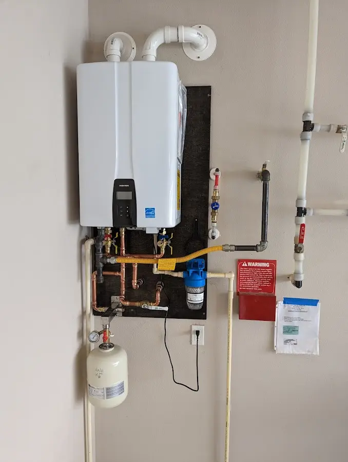 Professional plumber installing copper piping in a Sikeston home